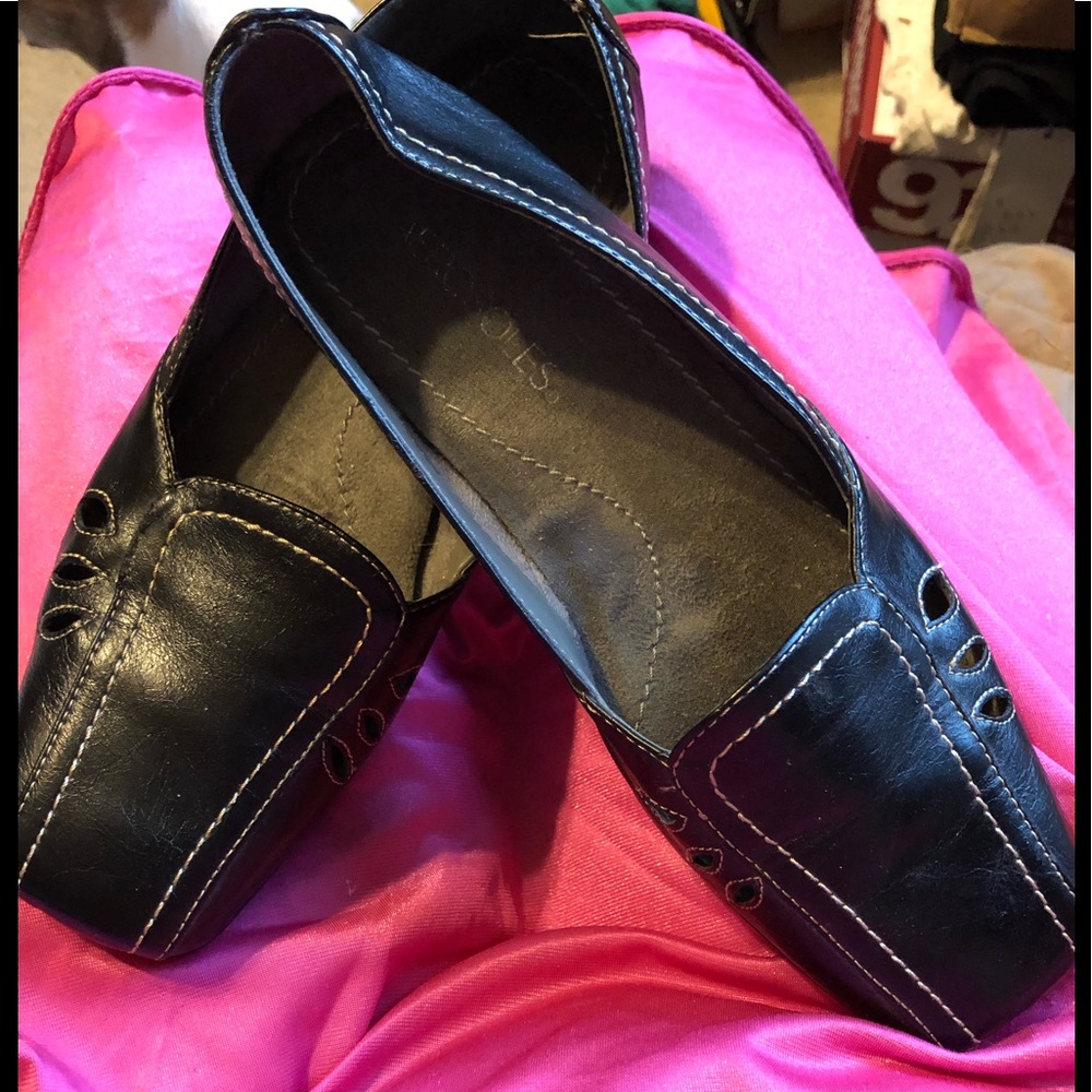 Brown cut out loafers.